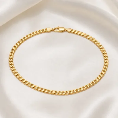Pulseira dourada elo gourmet 83979 Modelo B sobre cetim marfim