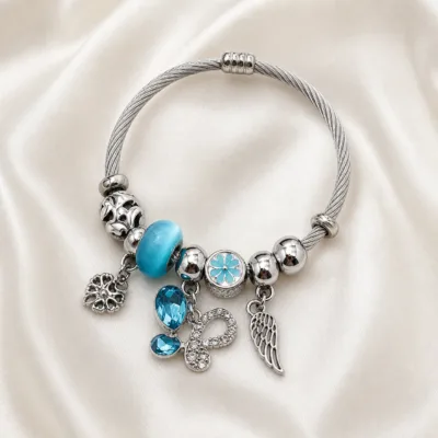 pulseira prateada turquesa com borboleta em cetim marfim, referencia 84039-03-2
