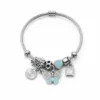 pulseira prateada com borboleta turquesa em fundo branco, referencia 84039-04-1