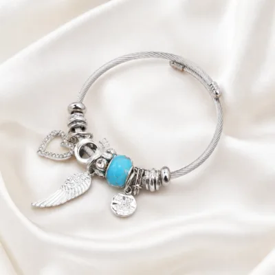 pulseira prateada com conta turquesa em cetim marfim, referencia 84039-05-1