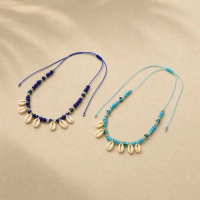 Comparação dos modelos azul-escuro e azul-claro do colar com búzios