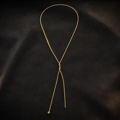 colar dourado em Y, fundo branco, referência 84728-01