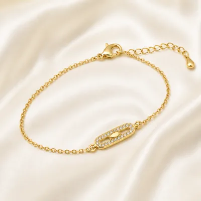 pulseira com cristais dourado em cetim marfim, referência 85203-01
