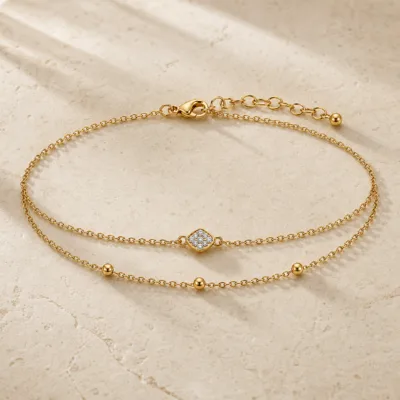pulseira dupla com cristais dourado em pedra clara de tom quente, referência 85203-02