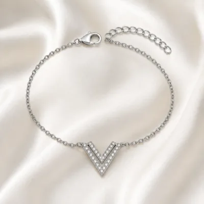 pulseira com duplo V prateado em cetim marfim, referência 85203-03