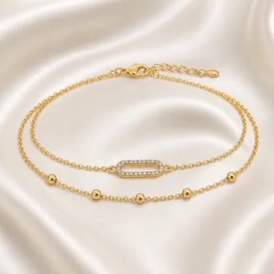 pulseira dupla com elo oval dourado em cetim marfim, referência 85203-04
