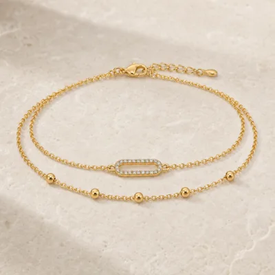 pulseira dupla com elo oval dourado em pedra clara de tom quente, referência 85203-04