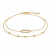 pulseira dupla com elo oval dourado em fundo branco, referência 85203-04