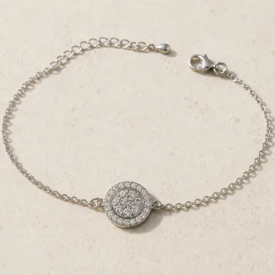 pulseira com medalhão circular prateado em pedra clara de tom quente, referência 85203-05