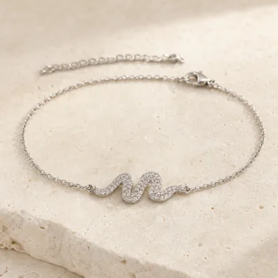 pulseira com ondas de cristais prateado em pedra clara de tom quente, referência 85203-06