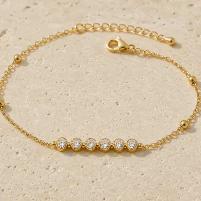 pulseira com seis contas de cristais dourado em pedra clara de tom quente, referência 85203-07