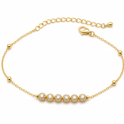 pulseira com seis contas de cristais dourado em fundo branco, referência 85203-07
