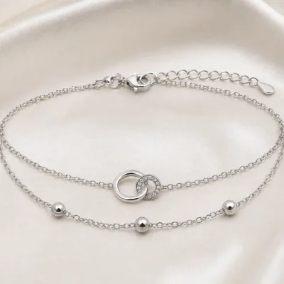 pulseira dupla com elos entrelaçados prateado em cetim marfim, referência 85203-08
