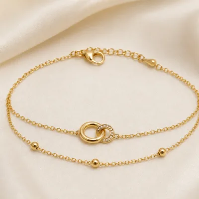 pulseira dupla com elos entrelaçados dourado em cetim marfim, referência 85203-08