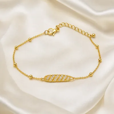 pulseira com folha de cristais dourado em cetim marfim, referência 85203-10