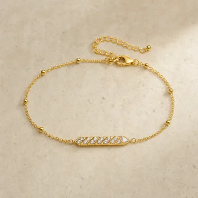 pulseira com folha de cristais dourado em pedra clara de tom quente, referência 85203-10