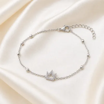 pulseira com coroa de cristais prateado em cetim marfim, referência 85203-12