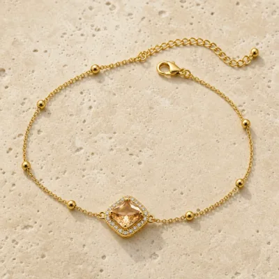 pulseira dupla com cristais dourado em pedra clara de tom quente, referência 85204-03