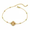 pulseira dupla com cristais dourado em fundo branco, referência 85204-03