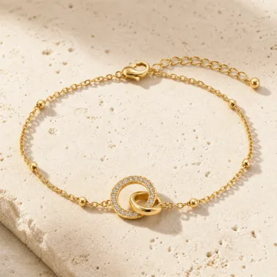 pulseira dupla com cristais dourado em pedra clara de tom quente, referência 85204-06