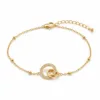 pulseira dupla com cristais dourado em fundo branco, referência 85204-06