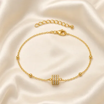 pulseira com cubo de cristais dourado em cetim marfim, referência 85204-12