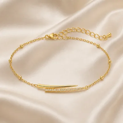 pulseira com barras assimétricas dourado em cetim marfim, referência 85204-13