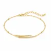 pulseira com barras assimétricas dourado em fundo branco, referência 85204-13