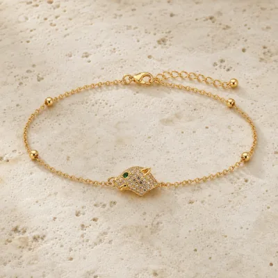 pulseira com cabeça de pantera dourado em pedra clara de tom quente, referência 85204-14