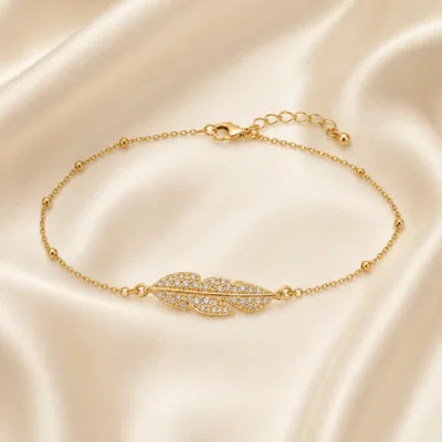 pulseira com duas penas de cristais dourado em cetim marfim, referência 85204-15