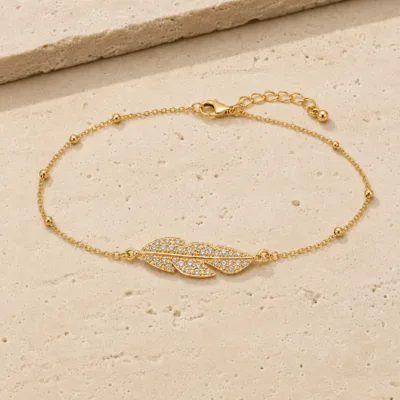 pulseira com duas penas de cristais dourado em pedra clara de tom quente, referência 85204-15