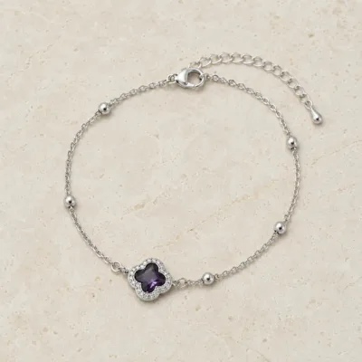 pulseira com trevo violeta de cristais prateado em pedra clara de tom quente, referência 85204-21