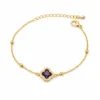 pulseira com trevo violeta de cristais dourado em fundo branco, referência 85204-21