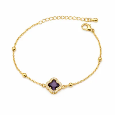 pulseira com trevo violeta de cristais dourado em fundo branco, referência 85204-21