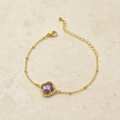 pulseira com flor violeta de cristais dourado em pedra clara de tom quente, referência 85204-22