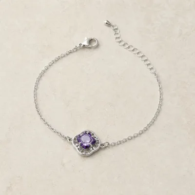 pulseira com flor violeta de cristais prateado em pedra clara de tom quente, referência 85204-22