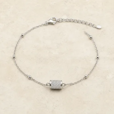 pulseira com cilindro pavé de cristais prateado em pedra clara de tom quente, referência 85204-25