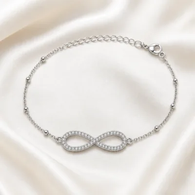 pulseira infinito pavé prateada em cetim marfim, referência 85204-28