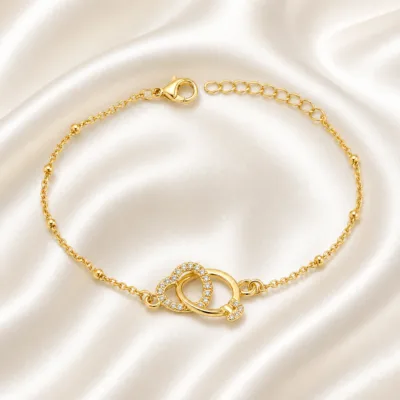 pulseira dupla com cristais dourado em cetim marfim, referência 85204-29