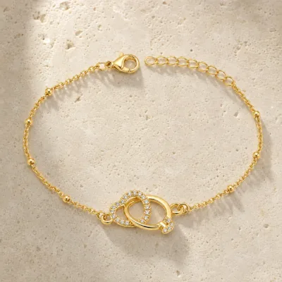 pulseira dupla com cristais dourado em pedra clara de tom quente, referência 85204-29