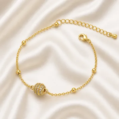 pulseira esfera pavé dourada em cetim marfim, referência 85204-30