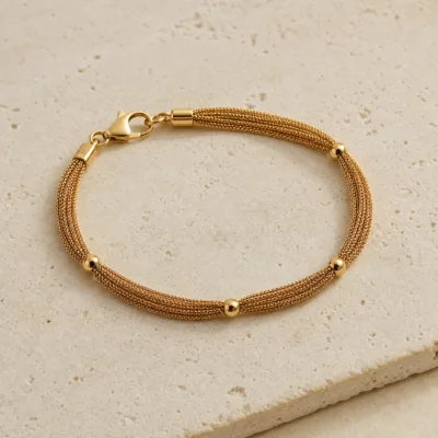 pulseira dourada de corrente multifiada em pedra clara de tom quente, referencia 85245-01
