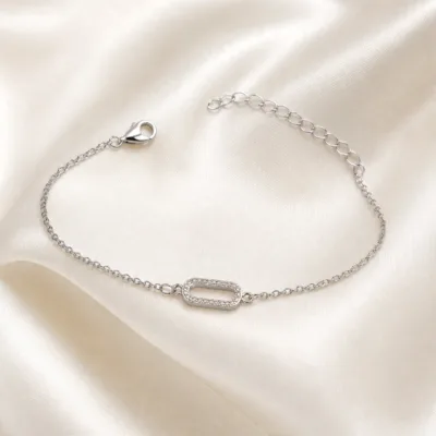 pulseira prateada com elo de cristais em cetim marfim, referencia 85245-01