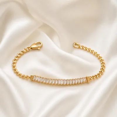 pulseira dourada com cristais baguete em cetim marfim, referencia 85246-01
