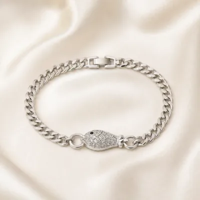pulseira prateada peixe com cristais em cetim marfim, referencia 85248-01