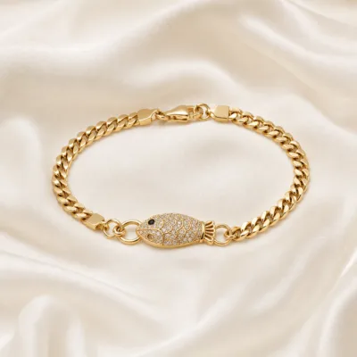pulseira dourada peixe com cristais em cetim marfim, referencia 85248-01