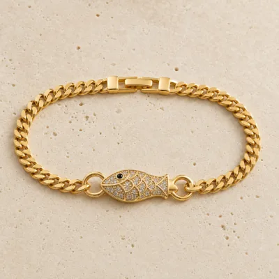 pulseira dourada peixe com cristais em pedra clara de tom quente, referencia 85248-01