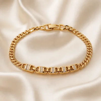 pulseira dourada com elos de cristais em cetim marfim, referencia 85248-02
