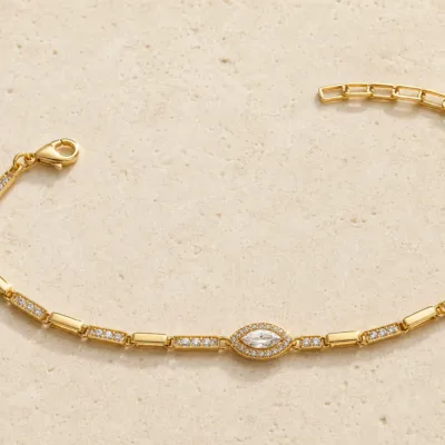 pulseira dourada com cristal marquise em pedra clara de tom quente, referencia 85250-01