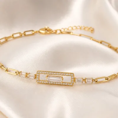 pulseira dourada com cristal retangular em cetim marfim, referencia 85251-01